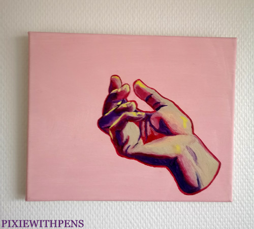 oil painted hand on pink background